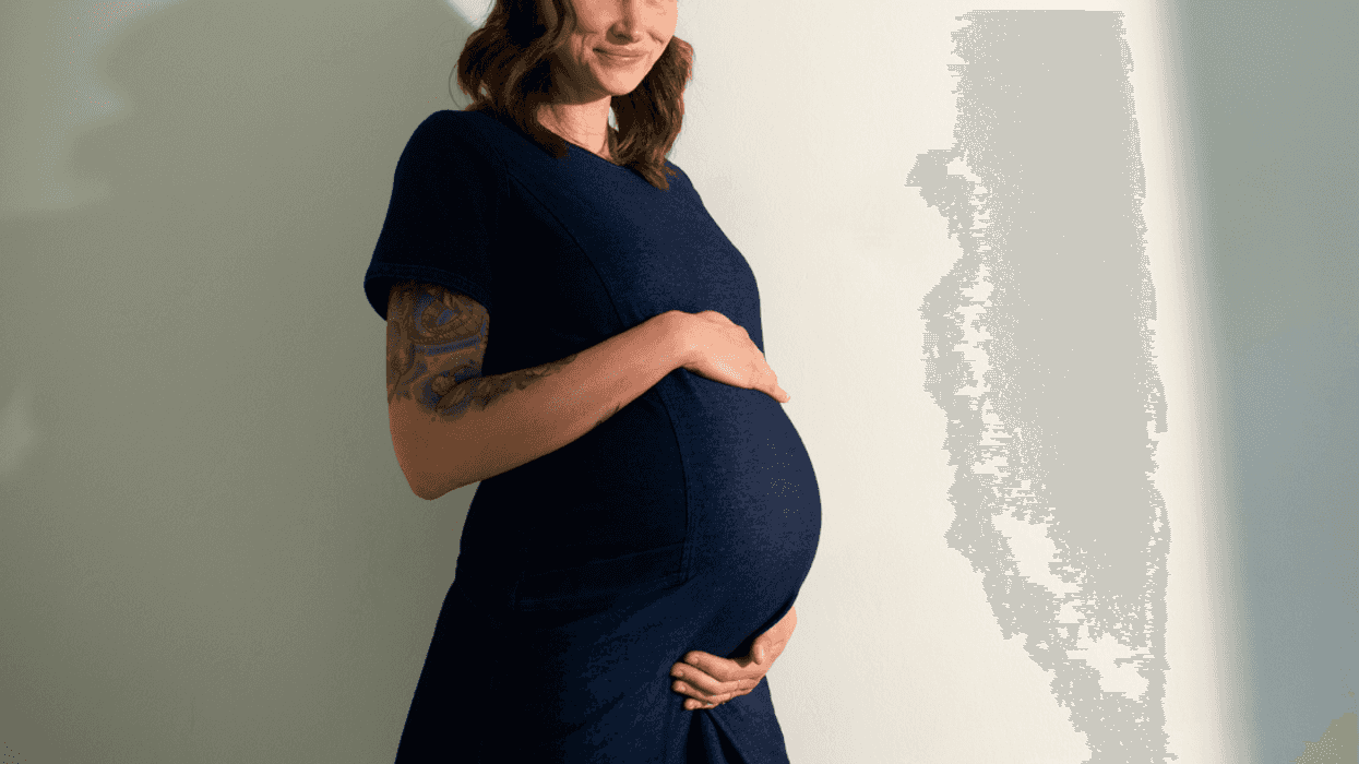 pregnant woman with hands on her belly