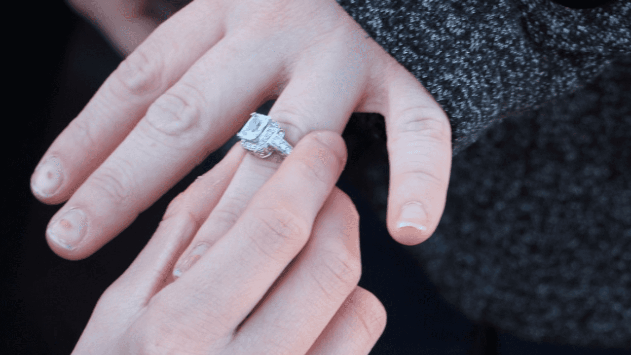 putting engagement ring on finger