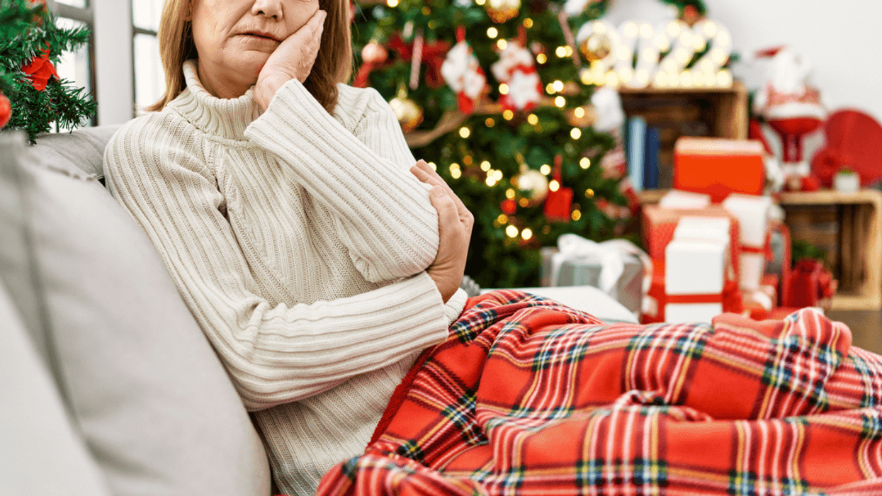 Sad woman sitting alone at Christmas
