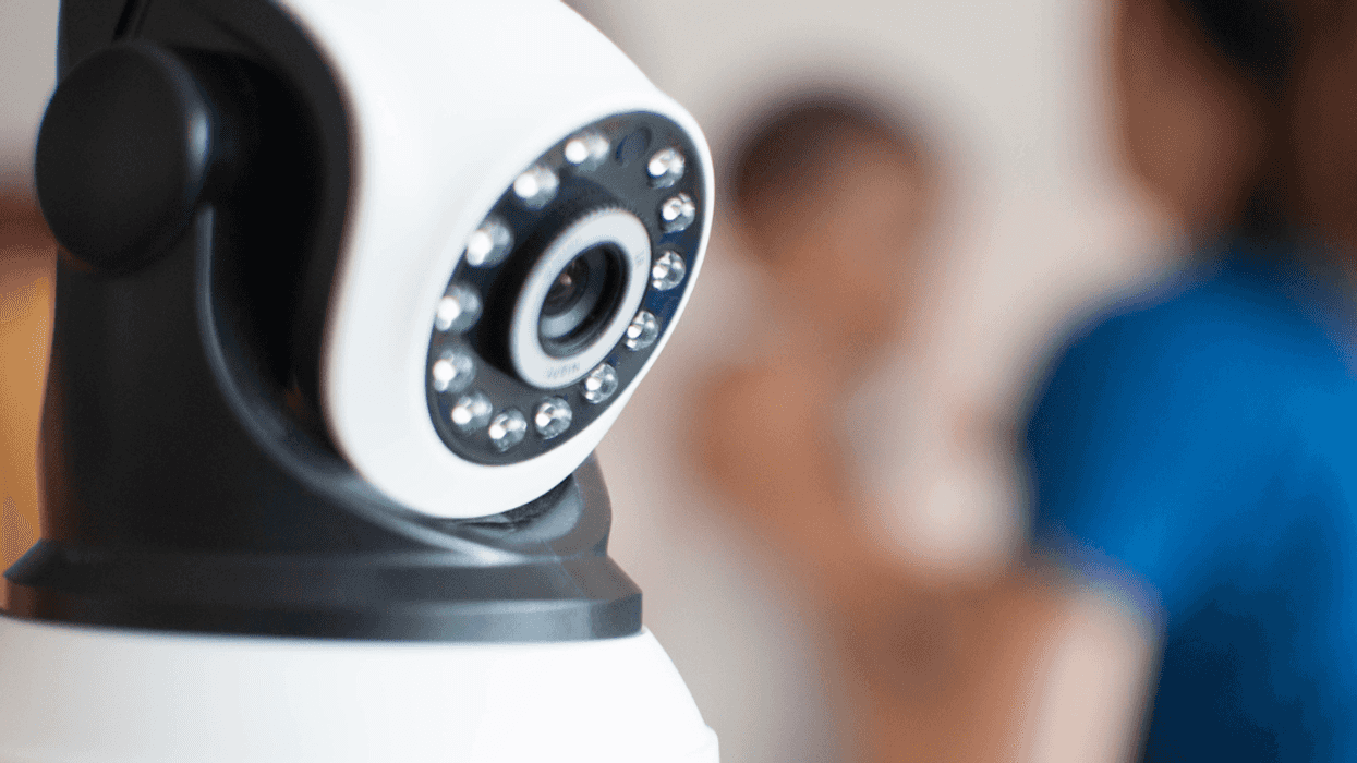 Security camera overlooking baby and guardian