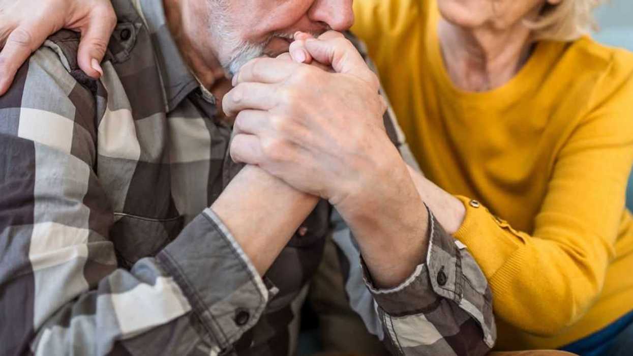 Senior wife expresses empathy and compassion to her sad husband.