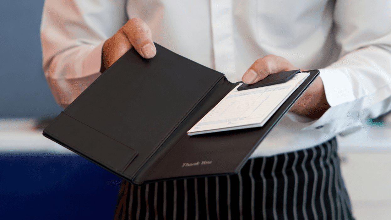 Server presenting a dinner bill