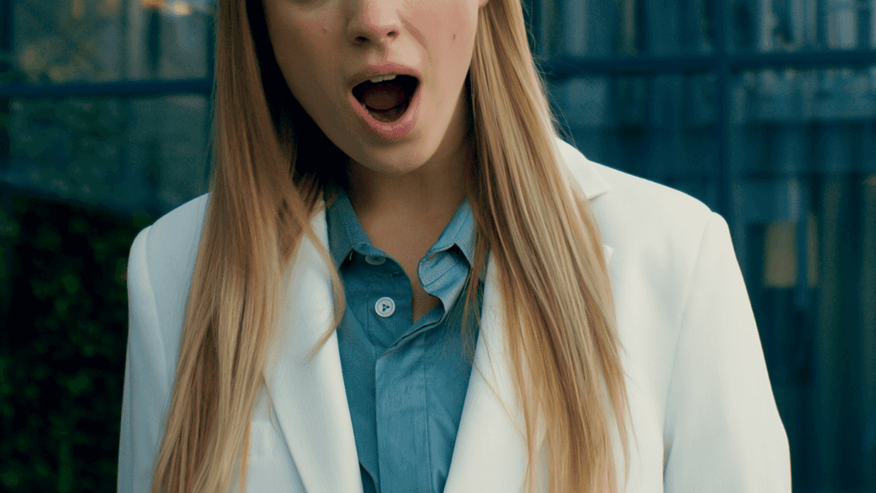 shocked young woman in office