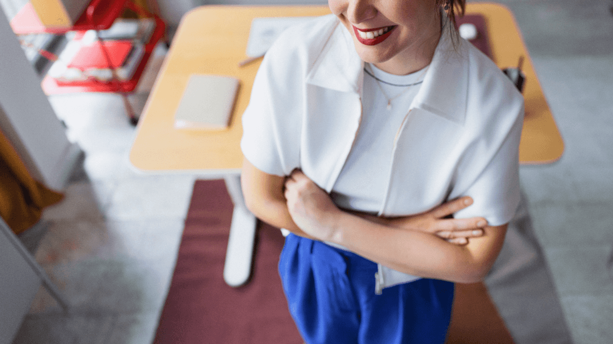 smiling woman standing in office