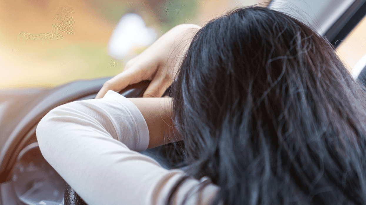 Stressed out woman in car
