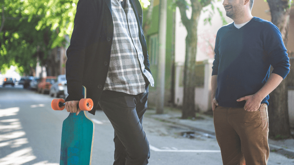 taller and shorter man talking