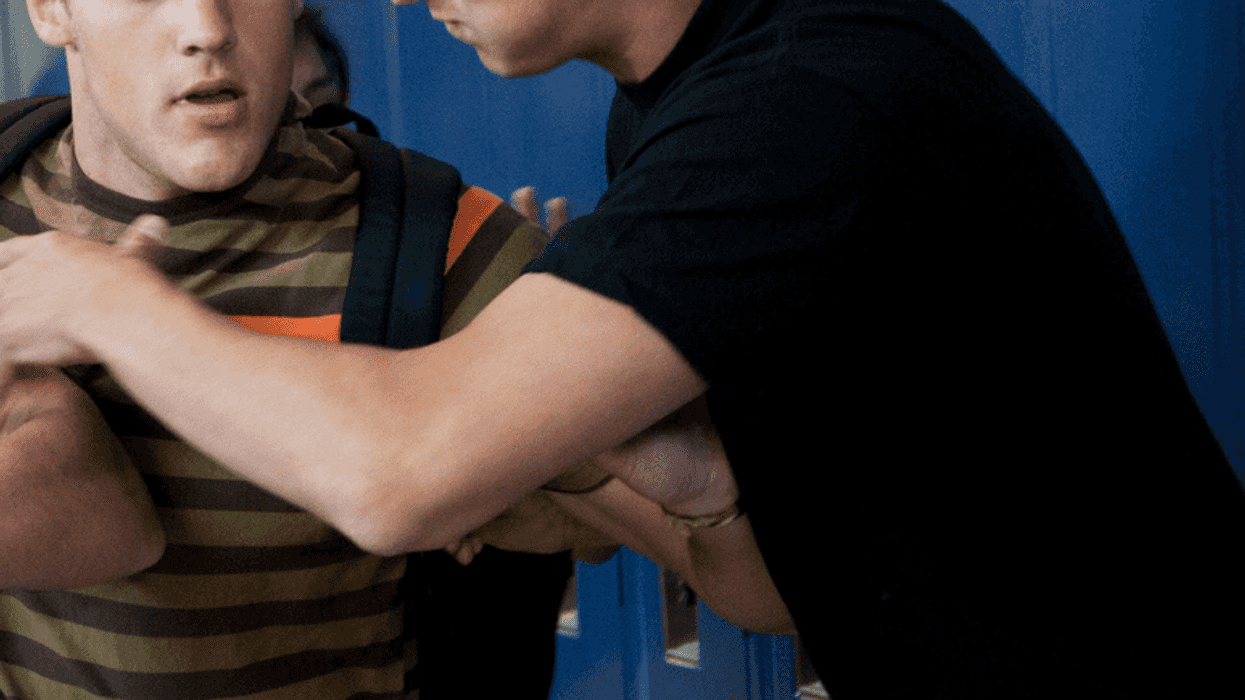 Teen boy bullying another teen boy