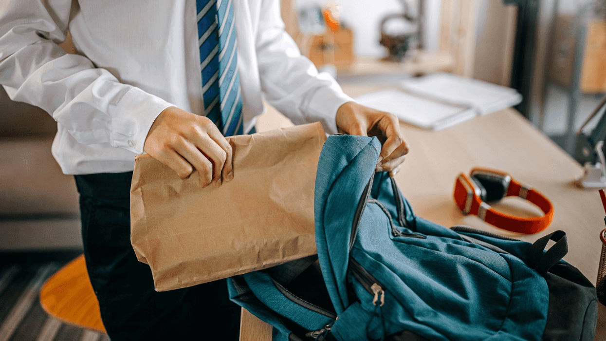 Teen boy making lunch