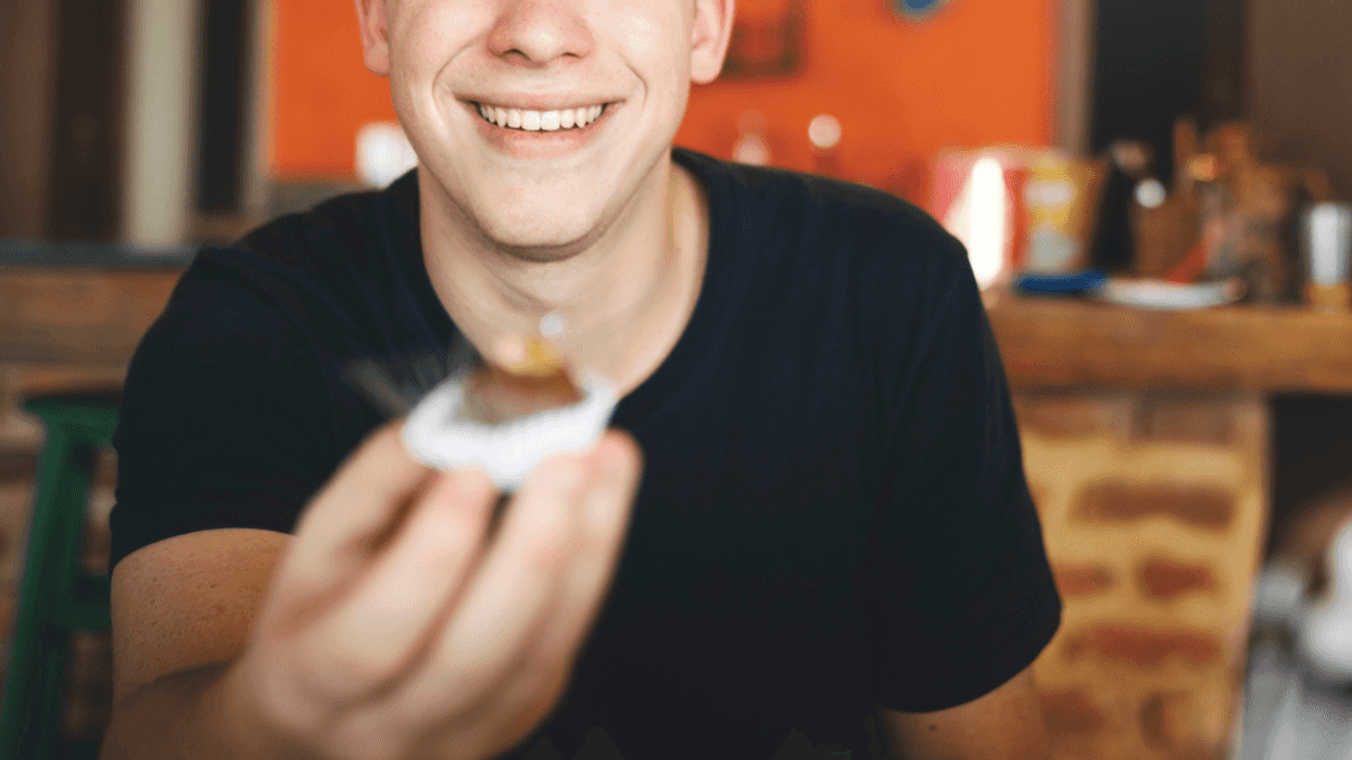 Teen enjoying food at restaurant