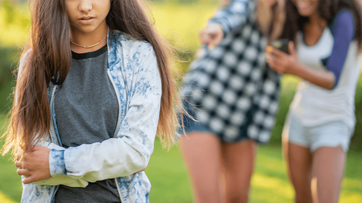 Teen girl being bullied by other teen girls