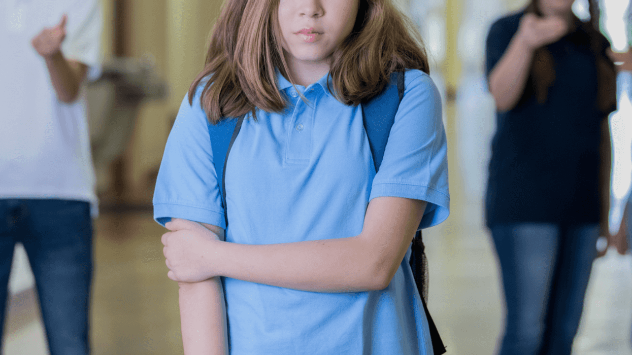 Teen girl being bullied by peers