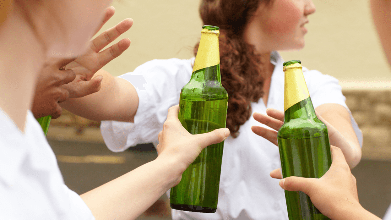 Teen girl being peer pressured to drink