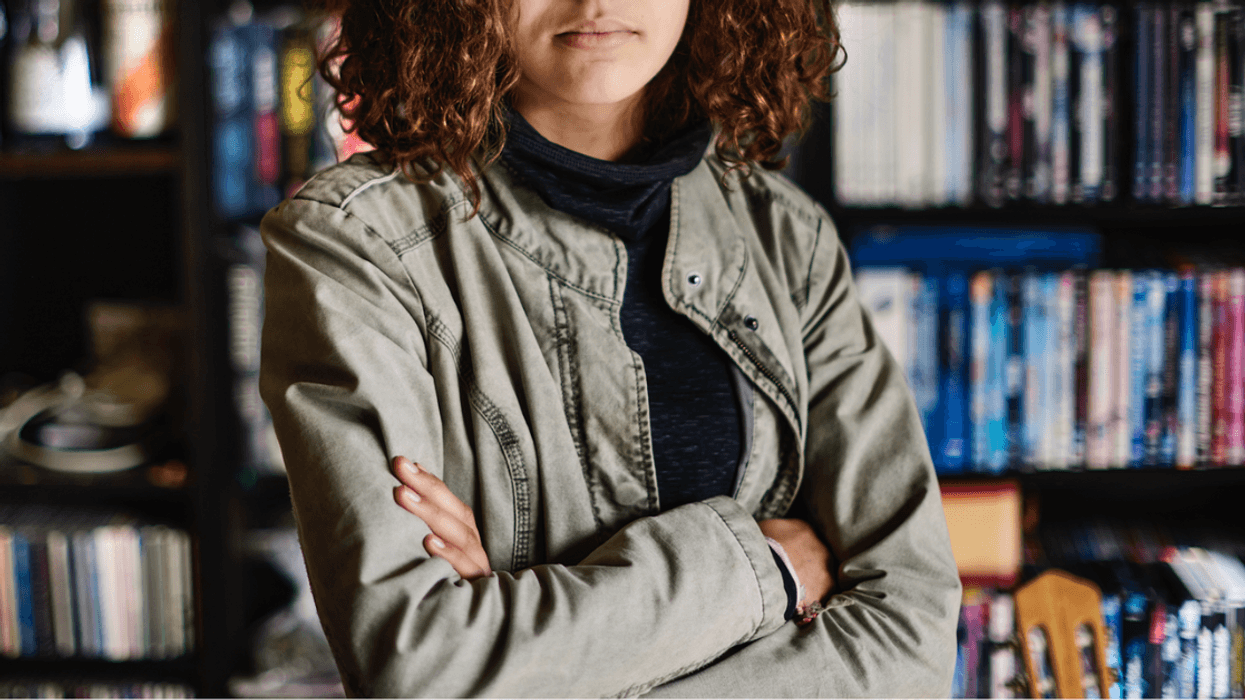 teen girl folding arms