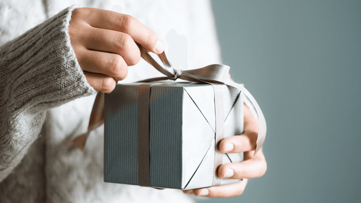 teen girl holding birthday present