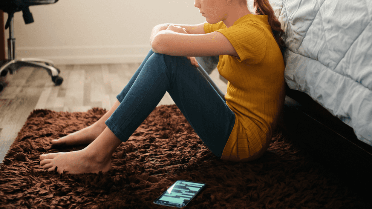 Teen girl pouting in her bedroom