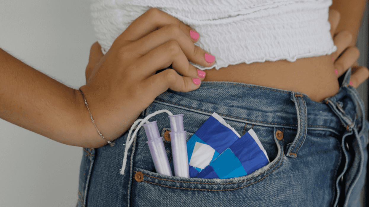 Teen girl with tampons sticking out of her pocket