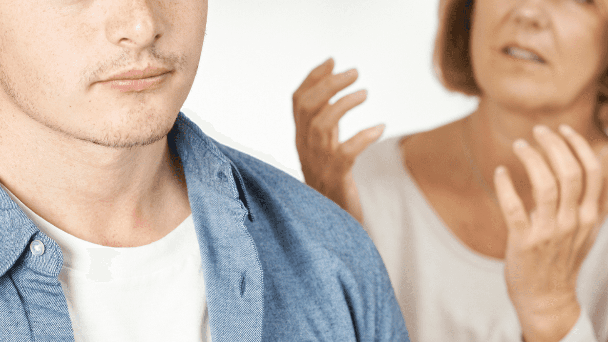 Teen ignoring his berating mother
