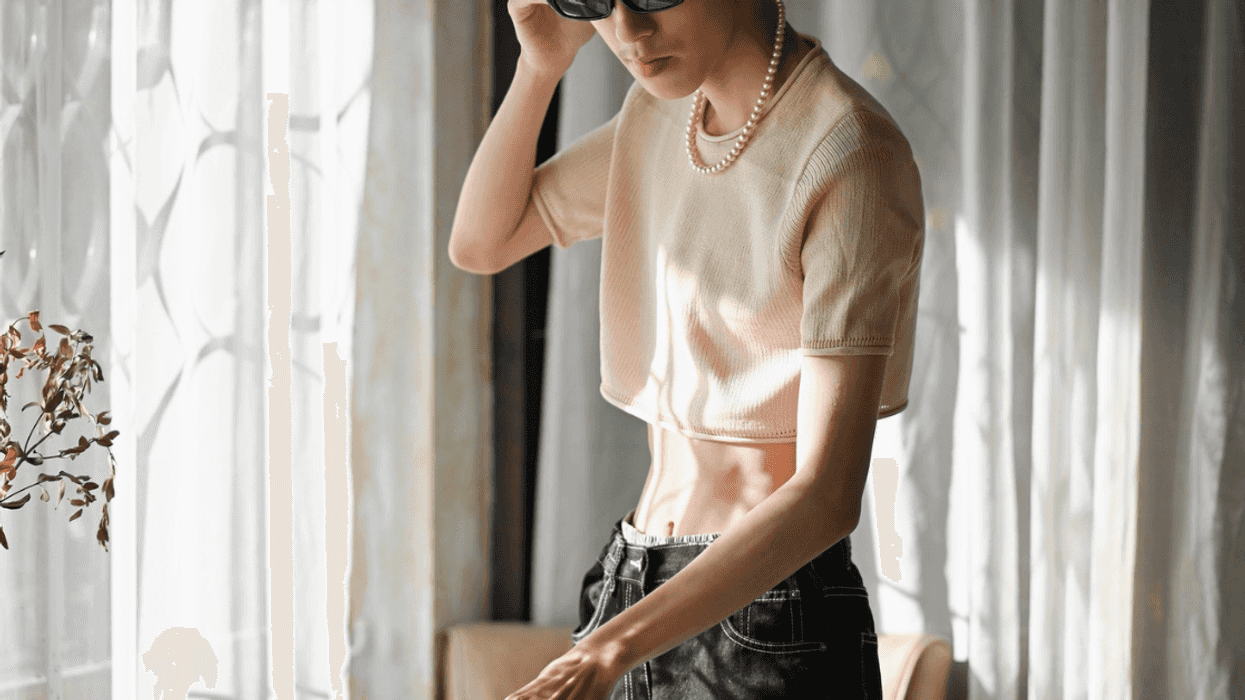 teen in crop top and jeans