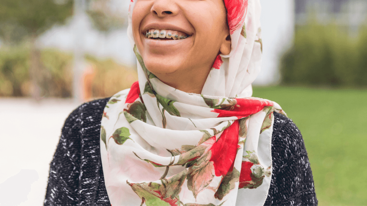 Teen Muslim girl smiling and wearing hijab