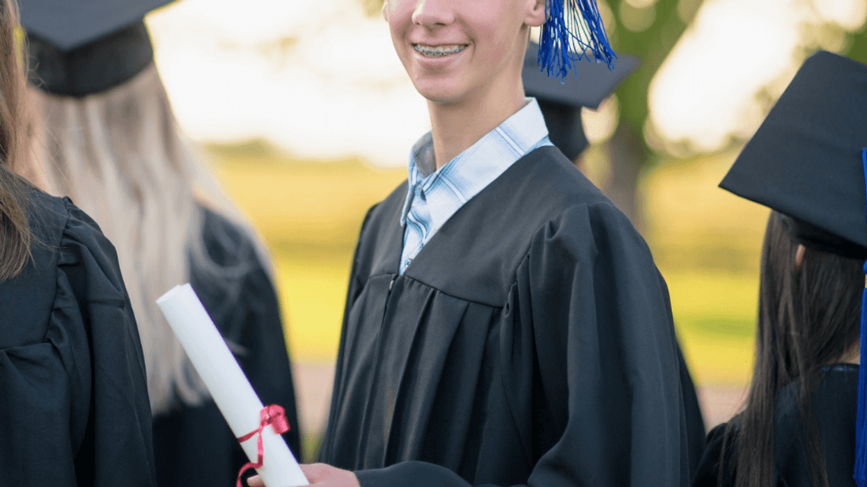 teenage boy at his high school graduation