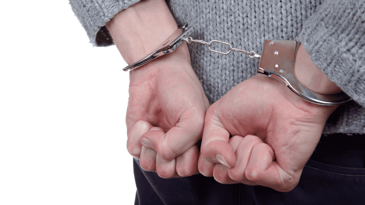 Teenage girl in handcuffs