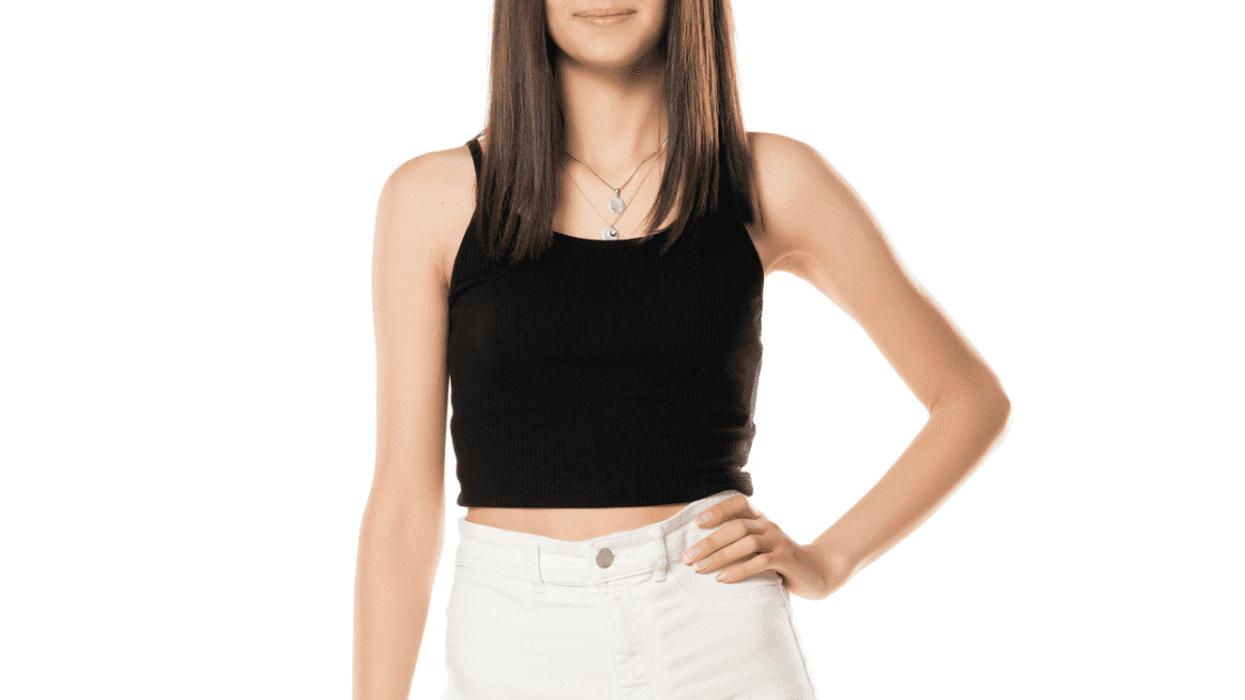 Teenage girl wearing white pants