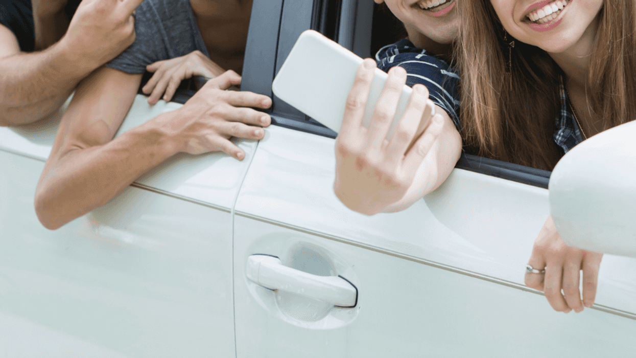 Teenagers in a car.