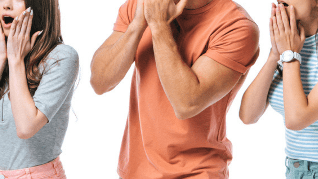 three people standing looking shocked