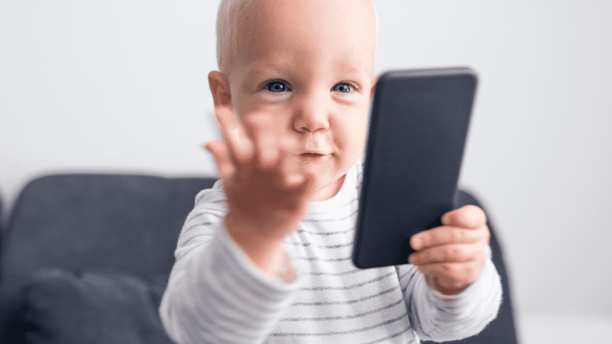 toddler with phone