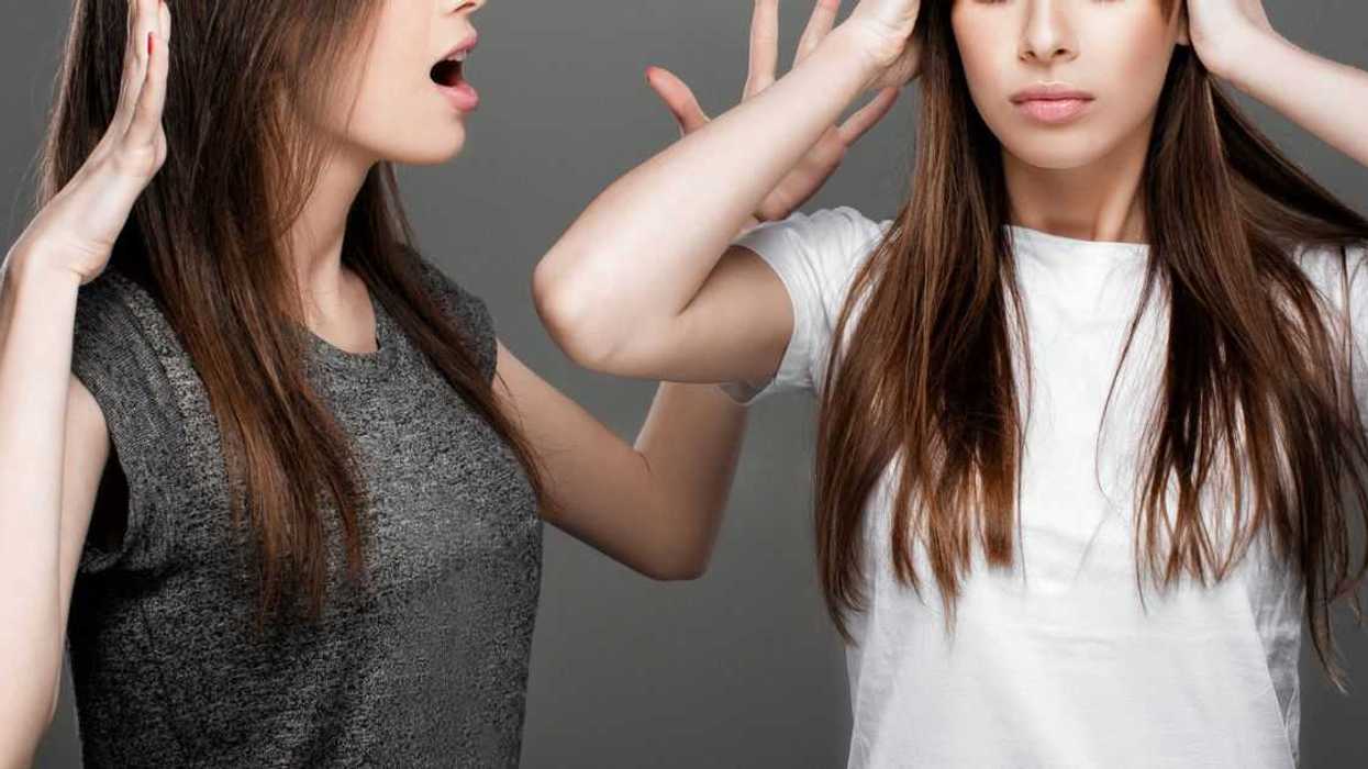 Twin sisters argue, one yells, the other covers hears