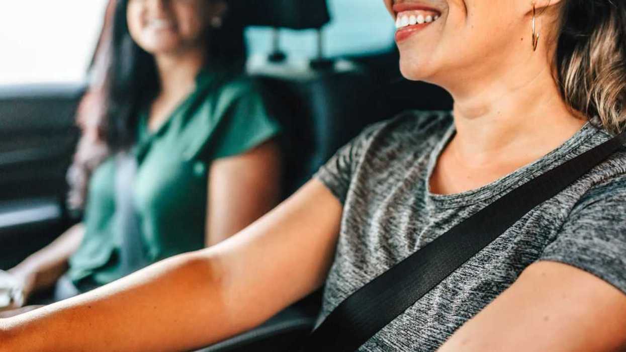 Two female friends traveling by car.
