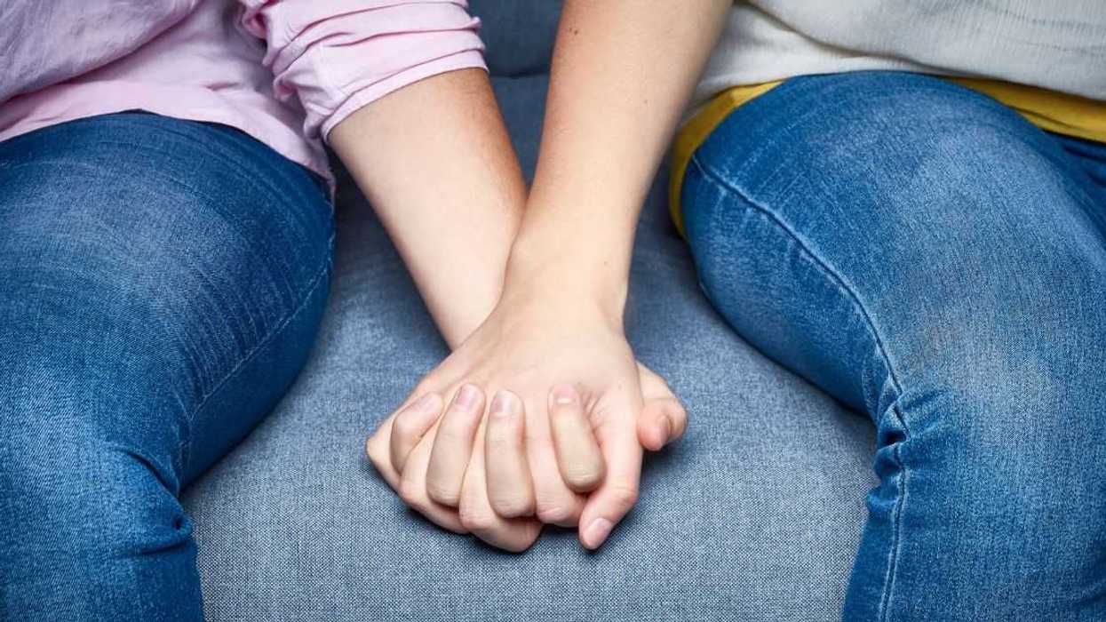 Two lesbians holding hands