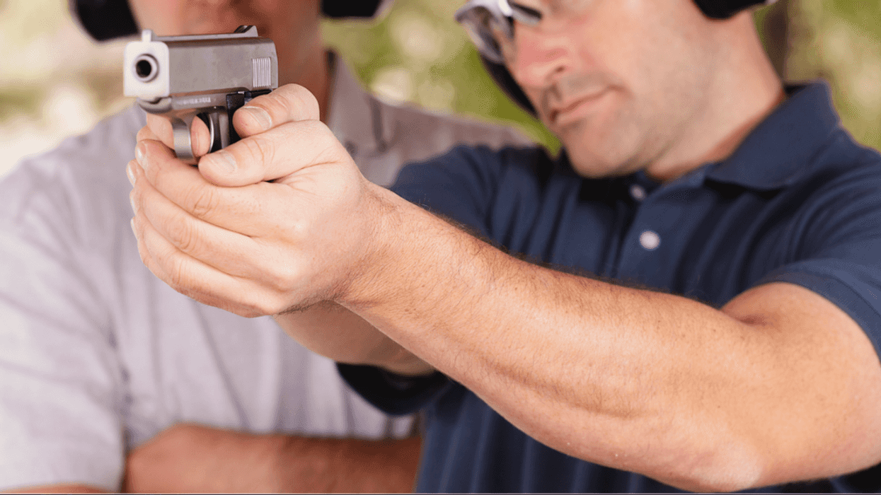 Two men at a shooting range.
