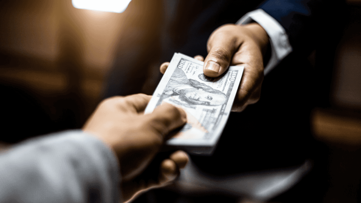 Two people exchanging money.