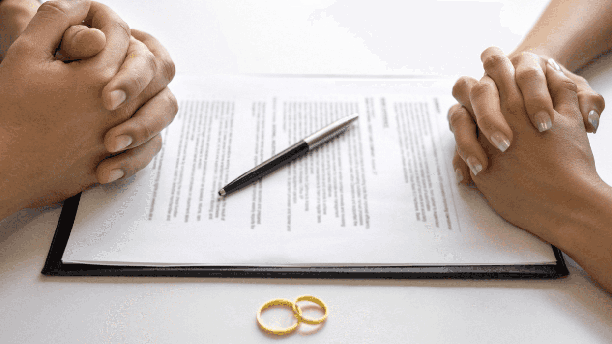 Two people filing divorce paperwork