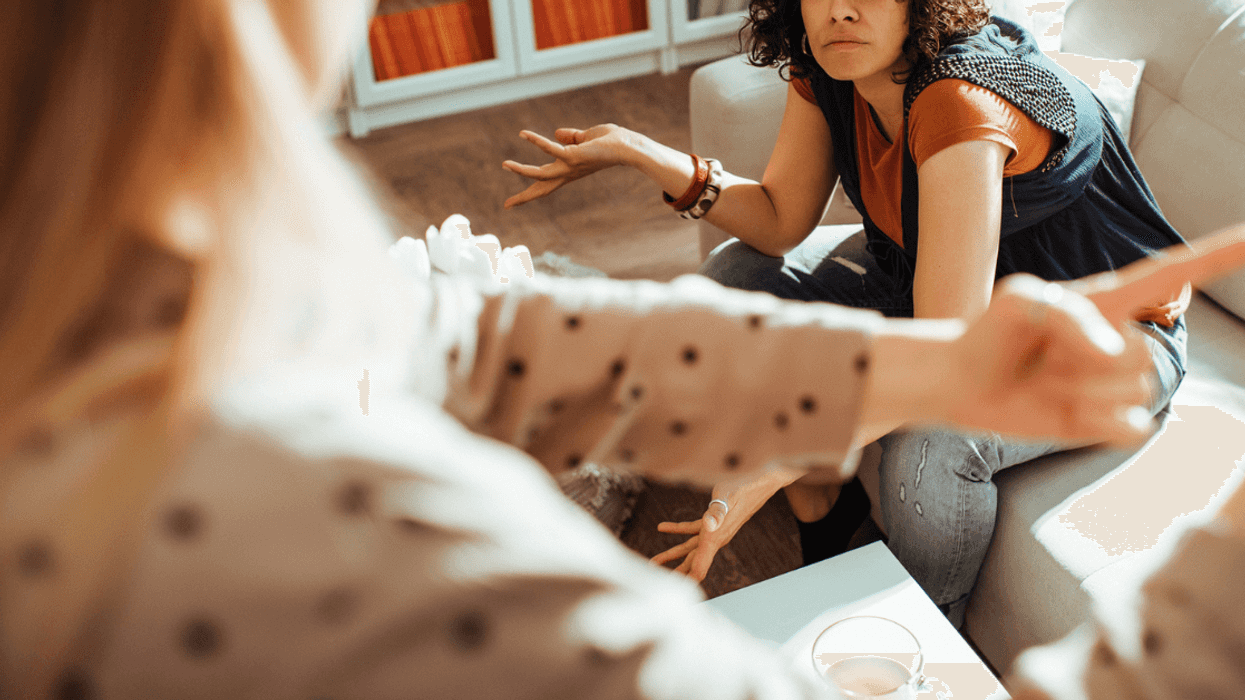Two women arguing in home