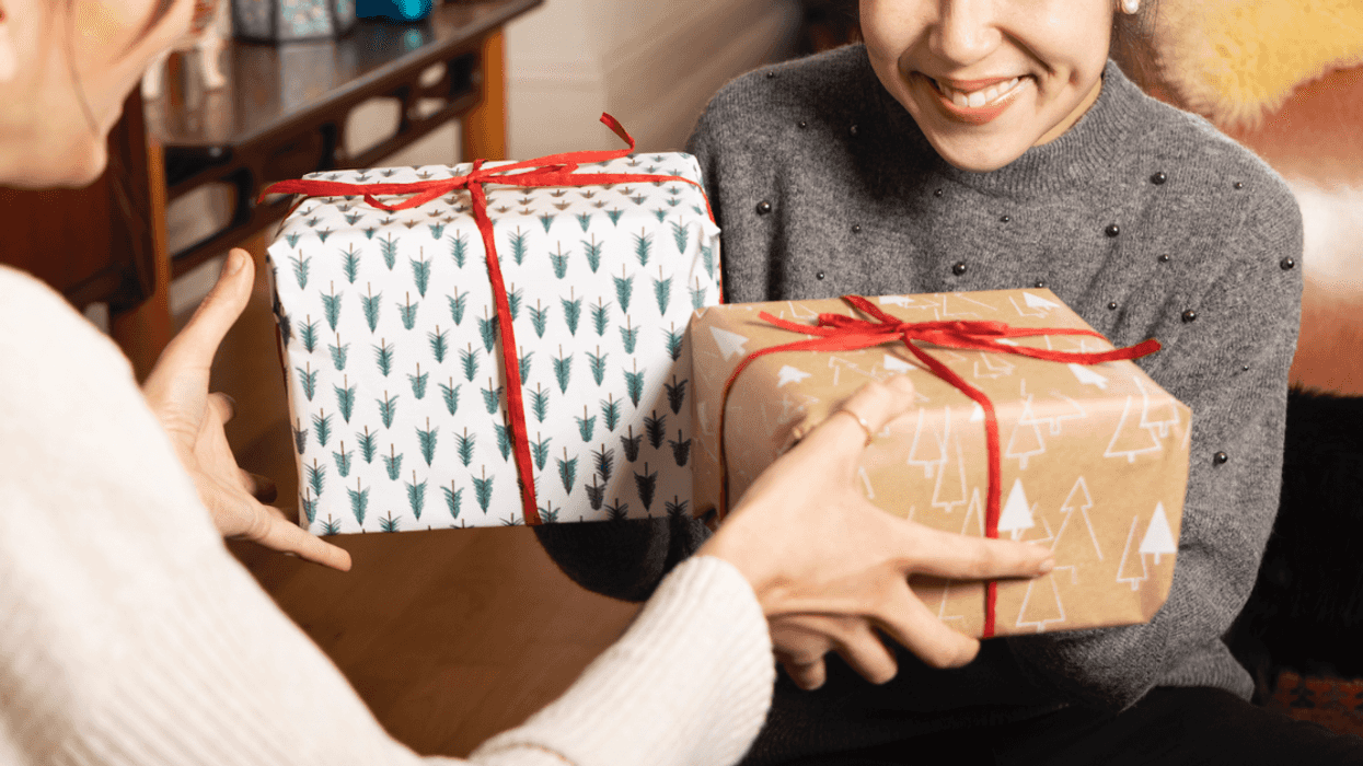 Two women exchanging presents.