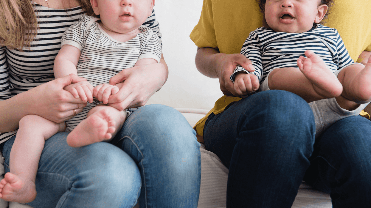 Two women holding babies