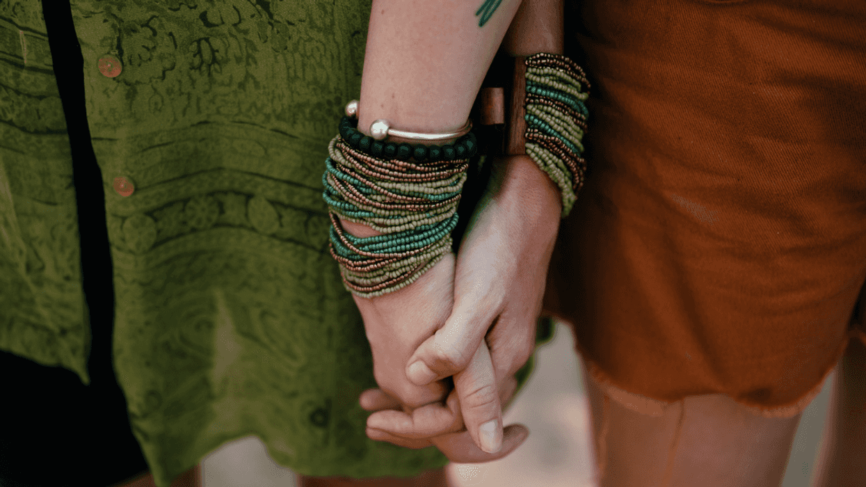 two women holding hands