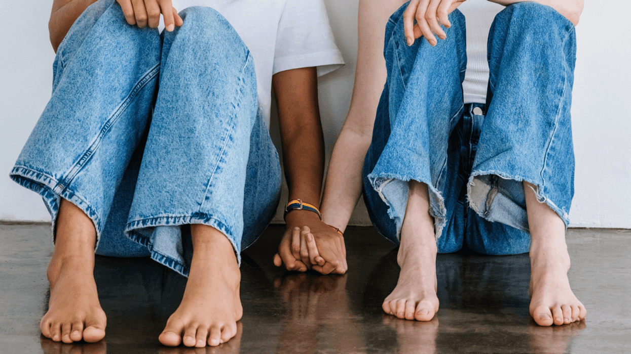 two women holding hands