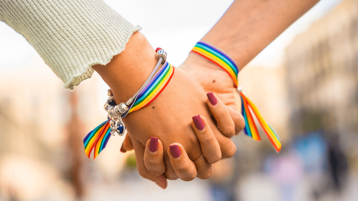 two women holding hands