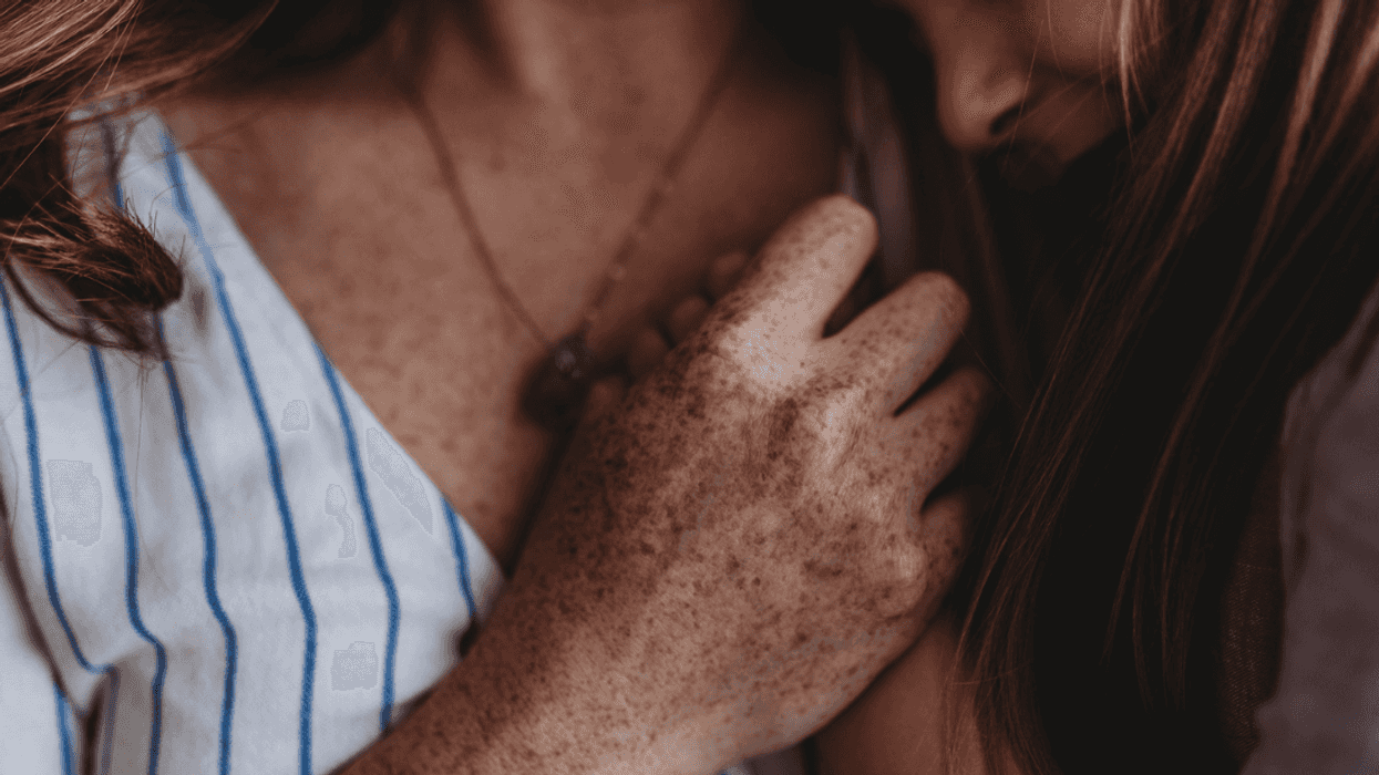 Two women in an embrace.