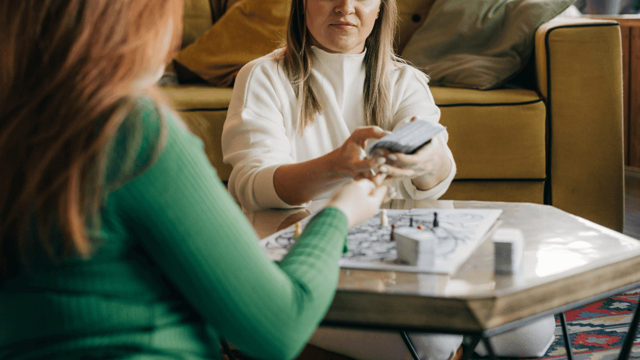 two women playing a board game