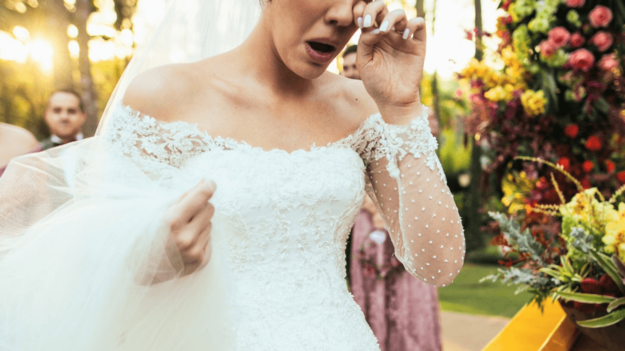 upset bride crying at wedding reception