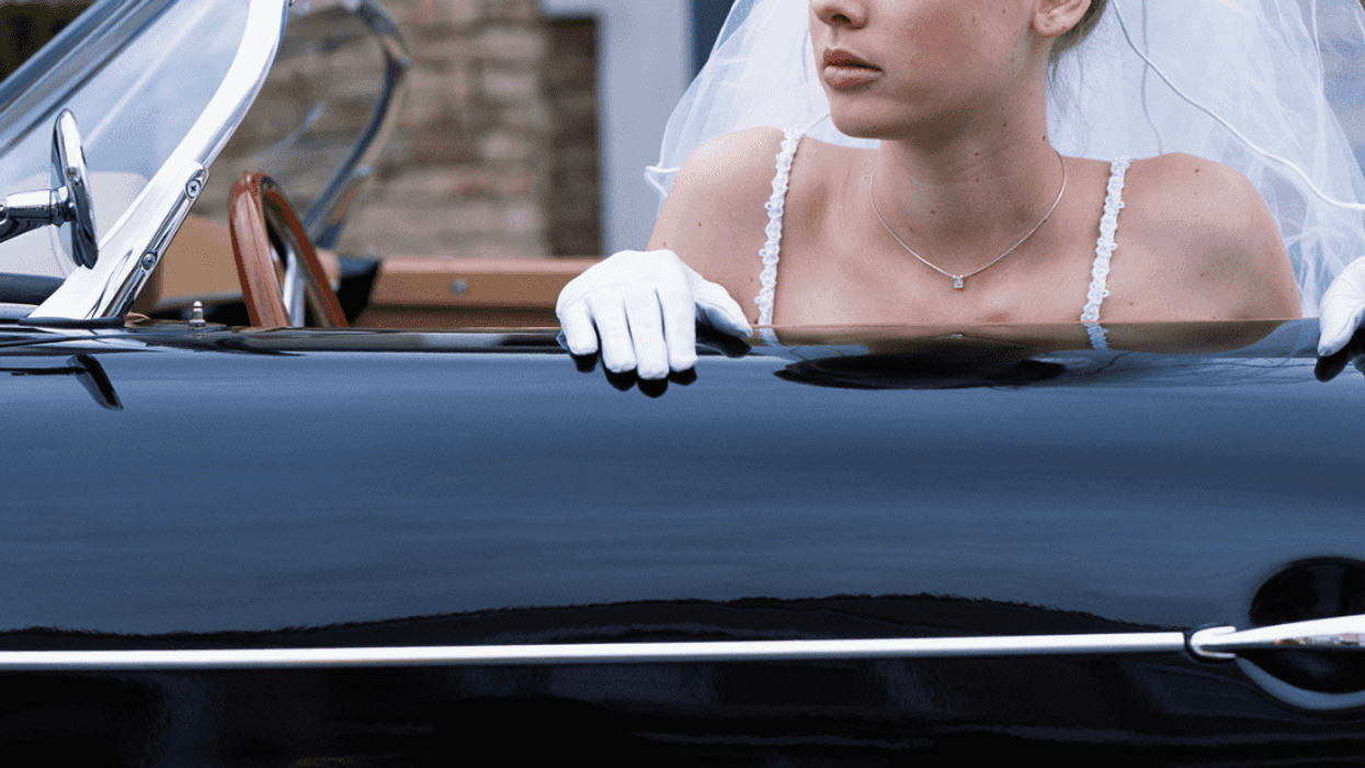 Upset bride in a car