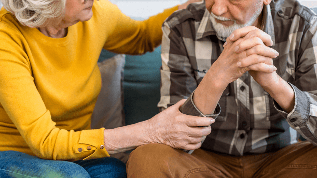 Upset elderly couple