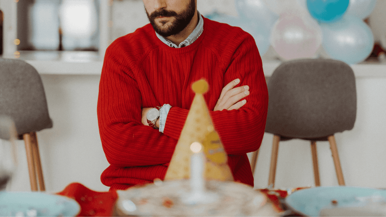 Upset man at his own birthday party
