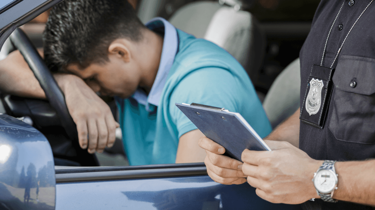upset man gets ticket from police officer
