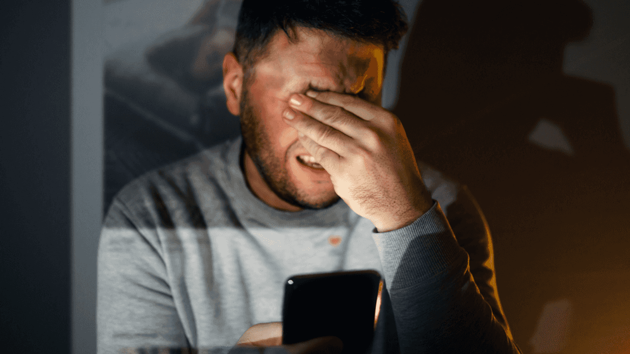 Upset man having a conversation on the phone