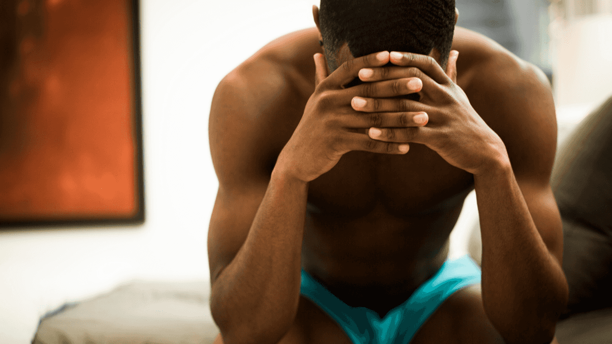 Upset man with hands on head